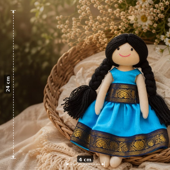 Doll in a blue dress with gold patterns, sitting in a woven basket with floral background